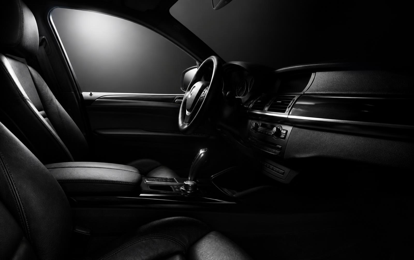 The same SUV interior fully restored, with conditioned leather and spotless carpets